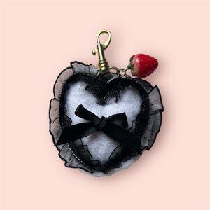 Heart-Shaped Black and White Keychain with Strawberry Charm